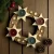 Dřevěný adventní svícen s hvězdami – 4 čajové svíčky